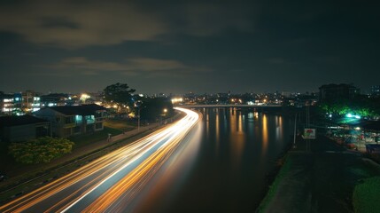 Obraz premium Long exposure photo of Brendeng Bridge (Jembatan Brendeng) across Cisadane River in Tangerang, Banten, Indonesia.