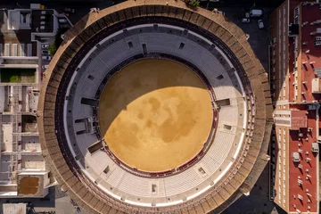 Fotobehang Stierenvechten Top down view of Spanish Bullring Malagueta Plaza de Toros arena incapsulated in residential area in Malaga  © Maarten Zeehandelaar