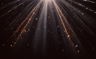 A dark sky with a bright light shining through it. The light is creating a beautiful and mysterious atmosphere