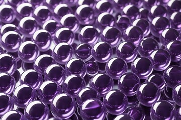 purple buttons are arranged in a large group on a white surface