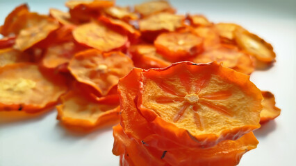 Persimmon fruit. Dried persimmon fruit. Dried persimmon. Persimmon rings. Dried persimmon at home.
