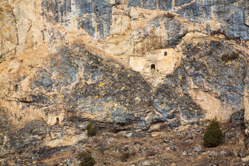 Ancient defensive towers in the cliffs in the mountains of Caucasus. Cmiti, North Ossetia, Russia