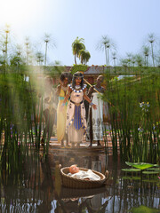 The pharaoh's daughter, the princess of Egypt, finding baby Moses in a basket flowing in the Nile river