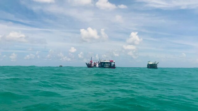 Boats on the high seas with ialorixas for offering to Yemanja. Yemanja's Day at sea