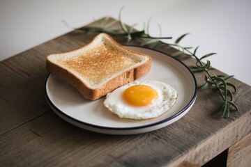 Fototapeta premium Simple Breakfast: Toasted Bread and Fried Egg