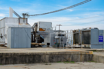An industrial ice machine stationed at a marina