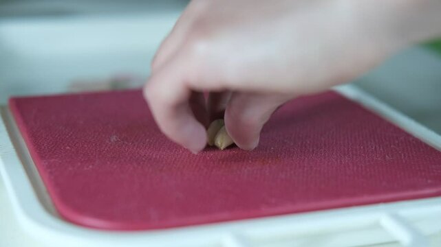 Chopping small garlic