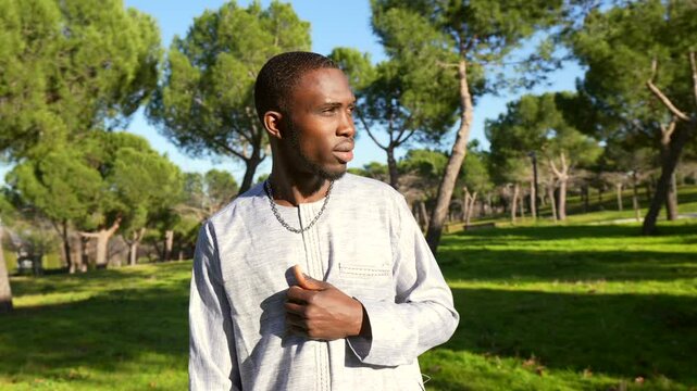 Senegalese man wearing traditional dashiki in a park