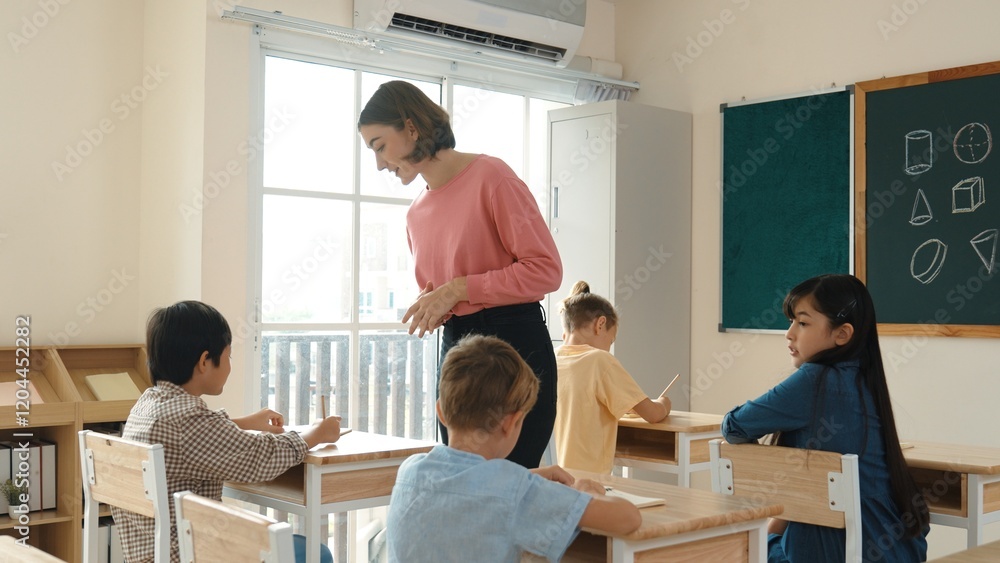 Poster caucasian teacher walking and check student homework at classroom while diverse children doing class