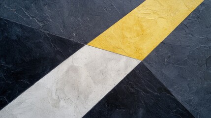 Close-up of a black and white geometric pattern. the pattern is made up of three diagonal lines, with the top line being yellow and the bottom line being white.