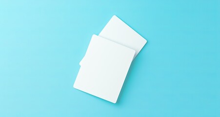 Two Blank White Plastic Card Mockups with Rounded and Rectangular Corners on Light Blue Background