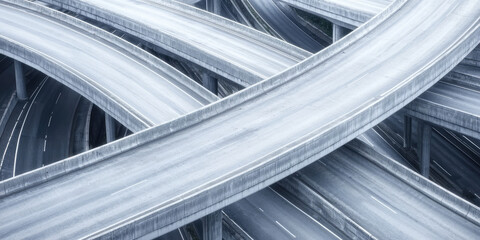 Obraz premium A maze of highways in a big city. Empty high-speed roads intertwine in different directions, multi-level road interchange