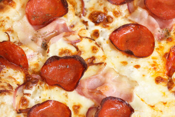 Ppepperoni pizza closeup. Juicy, fatty toppings. Delicious melted mozzarella cheese, crispy crust, and rich pepperoni slices. Classic Italian cuisine for a savory meal. American style pizza background