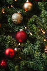 A close-up view of a decorated Christmas tree with ornaments and lights