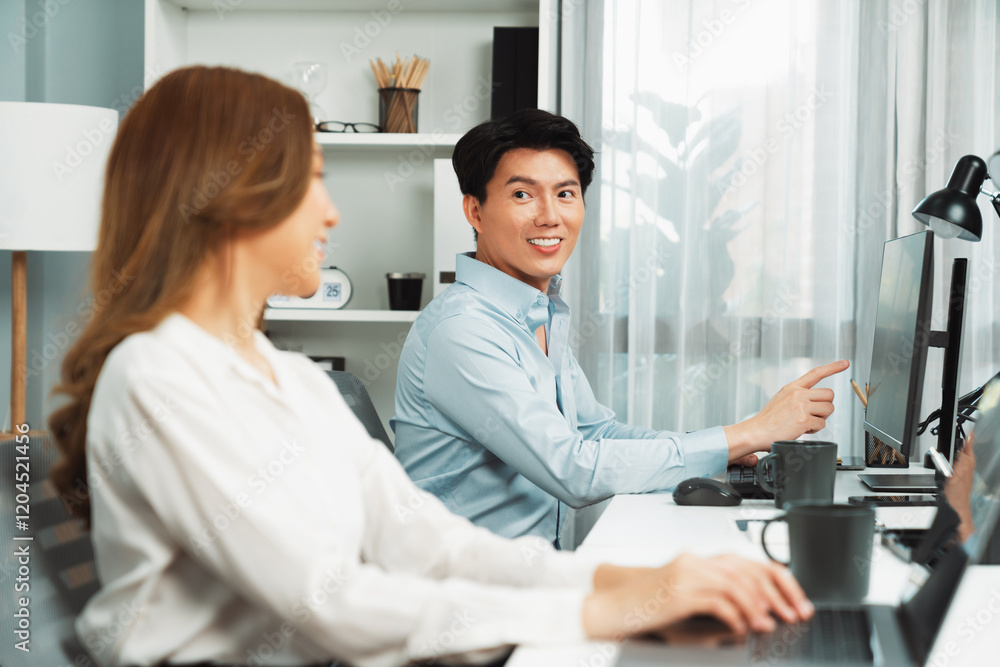 Poster smiling asian man talking with woman colleague in planning marketing report project on laptop casual