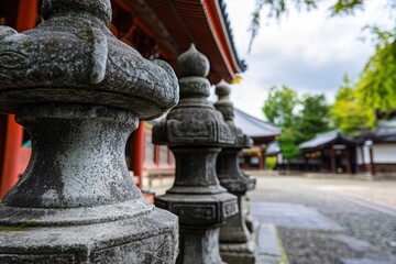 Obraz premium Row of stone pillars leading up to a building entrance