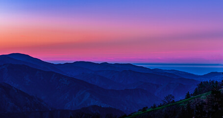 Fototapeta premium Big Sur Los Padres National Forest silhouetted ridges at dusk. 