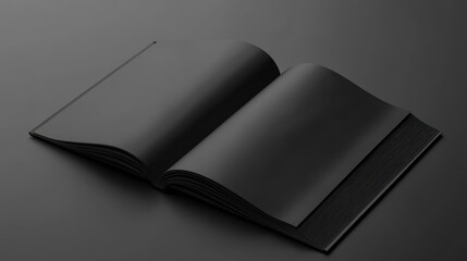 Open black book on dark surface.
