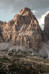 Majestic mountain range in Europe showcasing dramatic cliffs and rugged terrain under a cloudy sky