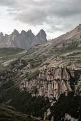 Majestic mountain range in Europe showcases rugged cliffs and dramatic peaks at dusk