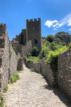 In Cotignac, a village in Provence, France, an ancient house is celebrated for its troglodyte dwellings embedded in tufa cliffs adorned with large stalactites, and its two feudal towers built in