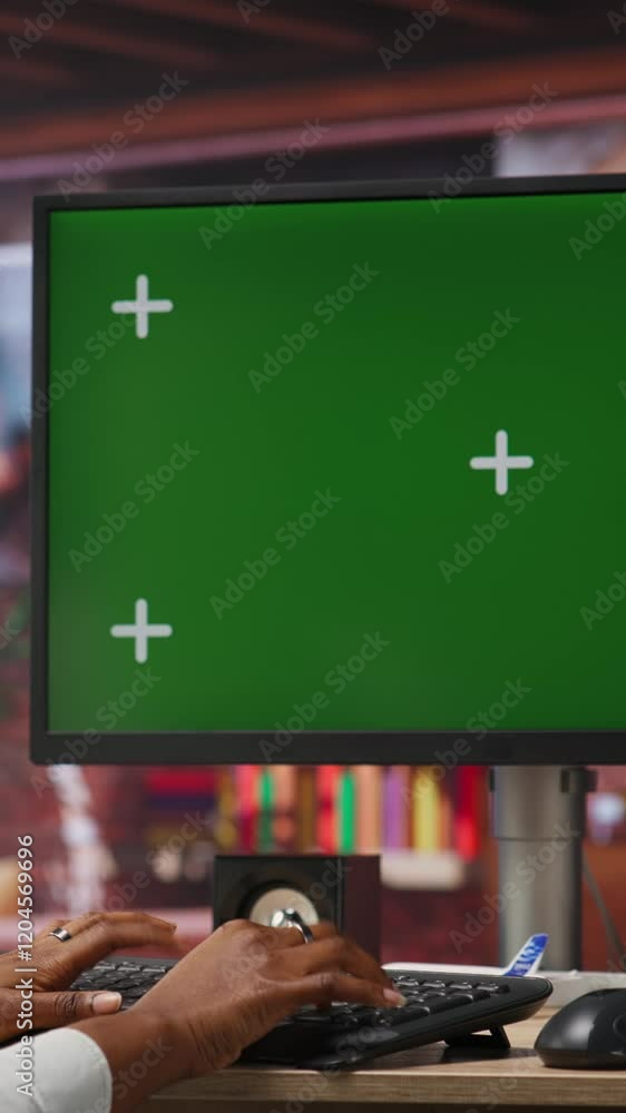 Poster vertical video remote employee in home office using green screen pc and mockup tablet to work on job