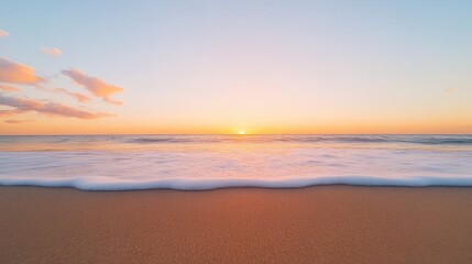 Fototapeta premium Serene sunset over a tranquil beach with gentle waves lapping at the shore, peaceful atmosphere