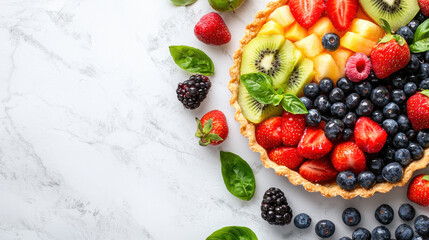 vibrant summer fruit tart featuring strawberries, blueberries, kiwi, and mint leaves, perfect for refreshing dessert