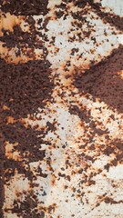 Rust on the iron for the background. old peeling paint on rusty gates.