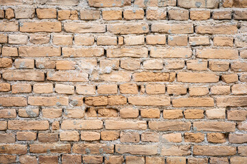 Rustic brick wall texture with red and brown tones