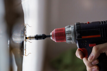 Close-Up of an Electric Drill in Use for Home Improvement