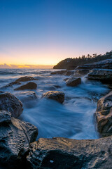 Beautiful dawn view on rocky coastline.