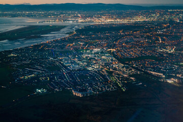 Aerial Dublin cityscape from an airplane landing at Dublin Airport in Ireland