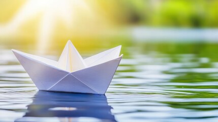 A white paper boat floats serenely on calm water, bathed in sunlight.