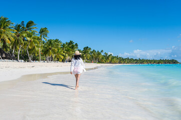 Woman walking on a beach in the Dominican Republic