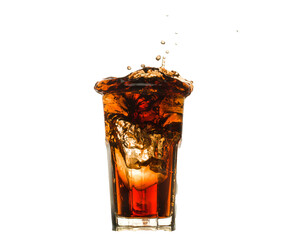 glass of ice cold cola with splashes
