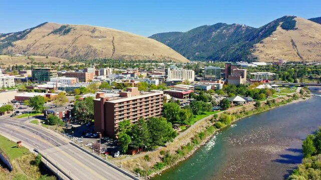 Fly over Missoula, Montana. Missoula is a city in and the county seat of Missoula County, Montana. It is located along the Clark Fork River.