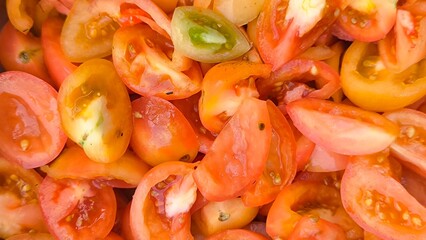 Sliced ​​tomatoes for background. Prepare tomatoes for cooking.