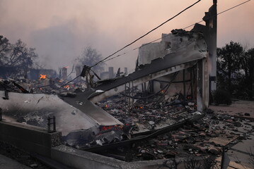 Rubble smoldering and burning in the palisades fire