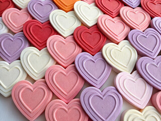 Fototapeta premium heart shaped candies background. heart, love, valentine, pink, hearts, day, valentines, shape, food, holiday, romance, red, dessert, symbol, romantic, chocolate, sweet, cookies, cookie, gift, wedding,