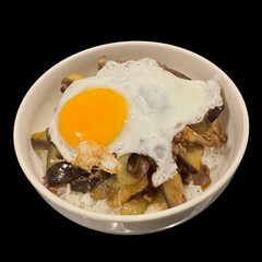 fried eggs with vegetables and spices on hot rice