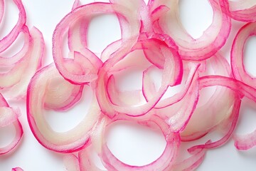 Detailed view of sliced pickled onion rings against a white backdrop