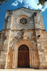 Fototapeta premium Medieval Church Facade Dramatic Lighting Architectural Details Stonework Sanctuary Taranto Puglia Italy