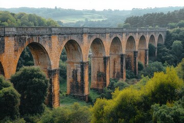 Ancient Stone Viaduct in Lush Green Landscape at Golden Hour in Taranto Puglia Italy
