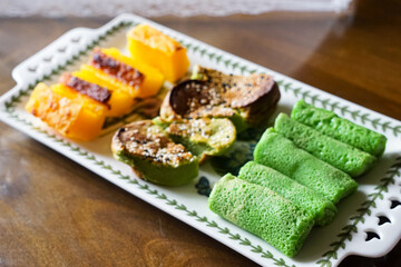 A plate of assorted traditional southeast asian desserts