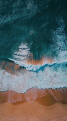 Naklejka premium Aerial View of Ocean Waves Crashing on Sandy Beach