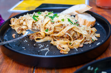 Pasta and Beef Bolognese Sauce. With Fresh Tagliatelle, Bread, and a Fork