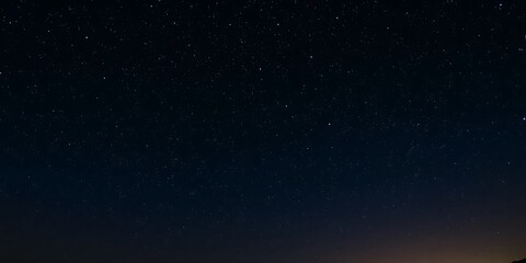 Fototapeta premium Night sky filled with sparkling stars against a black background, galaxy background, celestial, star background, Night sky with stars and galaxy in outer space, universe background