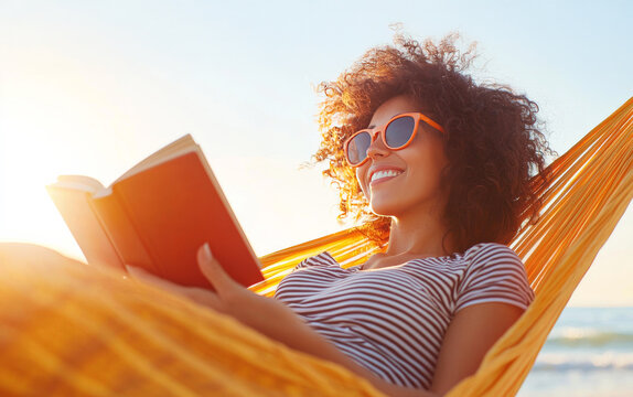 Relaxed Summer Reading: A young woman with a radiant smile and trendy sunglasses lies in a hammock, lost in a captivating book, enjoying the serenity of a summer afternoon.  - Powered by Adobe