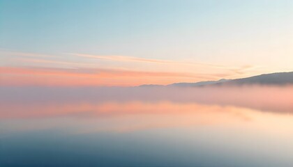 Obraz premium Misty Mountain Lake at Sunrise: A Serene Landscape